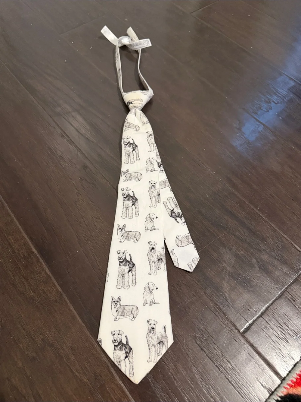 Janie and Jack Cream Tie with Black Dog Sketches